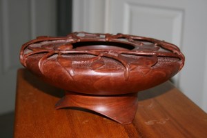 Bowl. I don't normally name my items, but I called this my Forest Floor bowl. Turned from a block of green Jarrah and then carved with leaves and branches. Base is also Jarrah.