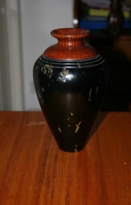 Vase. Turned from wood destined for the fire. Painted with faults treated with gold highlights. Camphor and Sheoak. 