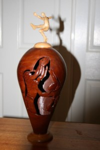 Vase. AFL carved features. Wall thickness about 5mm. Polish internally to match external. Jarrah and Jacaranda.